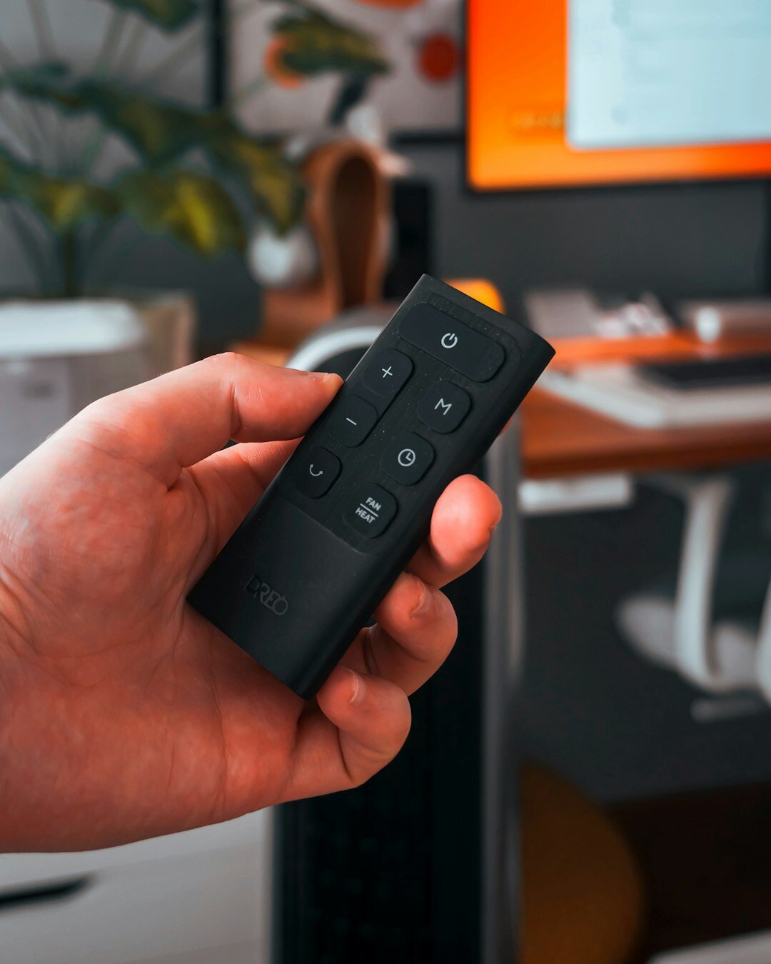 person using remote control for tv